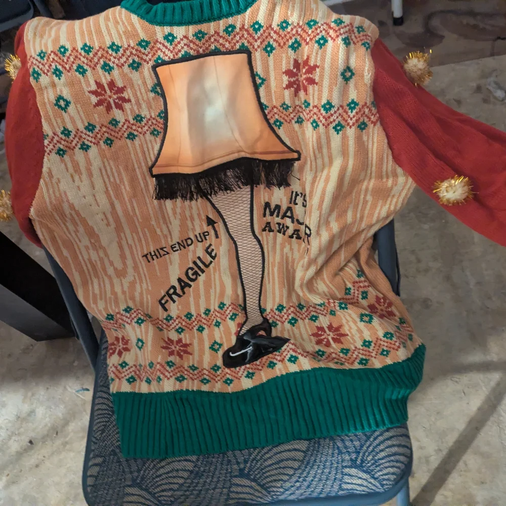 Spencer's Holiday Blanket with Light-Up Leg Lamp Design